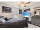 Spacious bedroom with a large bed, TV, and ample closet space at 2669 Champagne Gold Ave, North Las Vegas, NV 89086