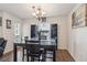 Modern dining room with glass-top table and hardwood floors at 2669 Champagne Gold Ave, North Las Vegas, NV 89086