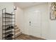 Entryway with a modern shoe rack and staircase at 2669 Champagne Gold Ave, North Las Vegas, NV 89086