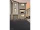 Three-story townhome with a private balcony and attached two-car garage at 2669 Champagne Gold Ave, North Las Vegas, NV 89086