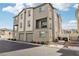 Three-story townhome with two-car garage, private patio, and neutral color palette at 2669 Champagne Gold Ave, North Las Vegas, NV 89086