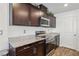 Kitchen features stainless steel appliances and granite countertops at 2669 Champagne Gold Ave, North Las Vegas, NV 89086