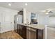 Kitchen features stainless steel appliances and granite countertops at 2669 Champagne Gold Ave, North Las Vegas, NV 89086