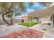 Backyard with covered patio, artificial turf, and a pool at 2923 Palora Ave, Las Vegas, NV 89121