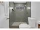 Updated bathroom with grey tile shower and toilet at 2923 Palora Ave, Las Vegas, NV 89121