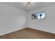 Simple bedroom with wood floors and a window at 2923 Palora Ave, Las Vegas, NV 89121