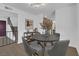 Dining area with modern table and chairs, view of kitchen and staircase at 2923 Palora Ave, Las Vegas, NV 89121