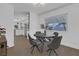 Modern dining room with round table and four grey chairs at 2923 Palora Ave, Las Vegas, NV 89121