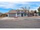 Two-story house with attached garage and mature tree in front at 2923 Palora Ave, Las Vegas, NV 89121