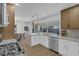 Modern kitchen with white cabinets, stainless steel appliances, and quartz countertops at 2923 Palora Ave, Las Vegas, NV 89121