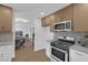 Stylish kitchen with white and wood cabinets, and a view into the dining area at 2923 Palora Ave, Las Vegas, NV 89121