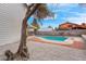 Relaxing pool area with diving board and gravel landscaping at 2923 Palora Ave, Las Vegas, NV 89121