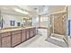 Main bathroom with double vanity, soaking tub, and walk-in shower at 2934 Tremont Ave, Henderson, NV 89052