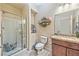 Bathroom with granite countertop, walk-in shower, and toilet at 2934 Tremont Ave, Henderson, NV 89052