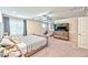 Main bedroom with striped bedding and large TV at 2934 Tremont Ave, Henderson, NV 89052