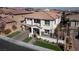 Two-story house with a driveway and landscaping, aerial view at 304 Elder View Dr, Las Vegas, NV 89138