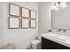 Modern bathroom with white subway tile, marble vanity, and contemporary mirror at 304 Elder View Dr, Las Vegas, NV 89138