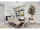 Modern dining room with a large table and contemporary light fixture at 304 Elder View Dr, Las Vegas, NV 89138