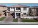 Two-story house with modern design, attached garage, and landscaped yard at 304 Elder View Dr, Las Vegas, NV 89138