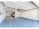 Spacious garage with overhead storage and epoxy flooring at 304 Elder View Dr, Las Vegas, NV 89138