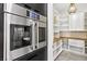 Modern kitchen pantry with wood shelving and white cabinetry at 304 Elder View Dr, Las Vegas, NV 89138