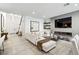 Spacious living room featuring a large sectional sofa, fireplace, and built-in shelving at 304 Elder View Dr, Las Vegas, NV 89138