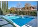 Inviting pool with spa and water features, surrounded by a paved patio at 304 Elder View Dr, Las Vegas, NV 89138