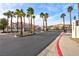 Gated community entrance with palm trees and street view at 3327 Erva St # 205, Las Vegas, NV 89117