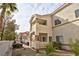 Two story building with light colored exterior and landscaping at 3327 Erva St # 205, Las Vegas, NV 89117