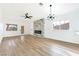 Bright and airy living room with hardwood floors and fireplace at 3327 Erva St # 205, Las Vegas, NV 89117