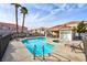 Community pool and spa area with surrounding patio furniture at 3327 Erva St # 205, Las Vegas, NV 89117