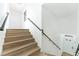 Modern staircase with wood treads and sleek metal railing at 3327 Erva St # 205, Las Vegas, NV 89117