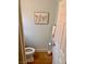 Small bathroom with toilet and wood floor at 3679 Wild Springs St, Las Vegas, NV 89129