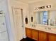 Double vanity bathroom with large mirror at 3679 Wild Springs St, Las Vegas, NV 89129