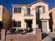 Two-story house with balcony, landscaped yard, and attached garage at 3679 Wild Springs St, Las Vegas, NV 89129