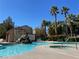 Inviting community pool and spa with palm trees and seating at 3679 Wild Springs St, Las Vegas, NV 89129