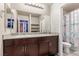 Double vanity bathroom with granite countertop and a shower/tub combo at 4036 Floating Fern Ave, North Las Vegas, NV 89084