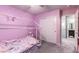 Pink bedroom with unicorn theme and double closet at 4036 Floating Fern Ave, North Las Vegas, NV 89084