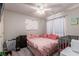 Bedroom with pink bedding and ceiling fan at 4036 Floating Fern Ave, North Las Vegas, NV 89084