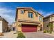 Two-story house with red garage door and small front yard at 4036 Floating Fern Ave, North Las Vegas, NV 89084