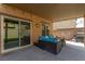 Covered patio with seating area, string lights and a view of the backyard at 4036 Floating Fern Ave, North Las Vegas, NV 89084