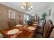 Formal dining room featuring a large wood table and seating for eight at 4365 Topaz St, Las Vegas, NV 89121