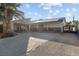 Single-story home with solar panels, gated entrance and large driveway at 4365 Topaz St, Las Vegas, NV 89121