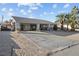 House with covered entryway, gated entrance, and desert landscaping at 4365 Topaz St, Las Vegas, NV 89121