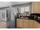 Spacious kitchen with stainless steel appliances and light beige cabinets at 4365 Topaz St, Las Vegas, NV 89121