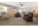 Large main bedroom with seating area and ceiling fan at 4365 Topaz St, Las Vegas, NV 89121