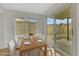 Virtually staged dining area with wood table and sliding glass doors at 4642 Via San Rafael, Las Vegas, NV 89103