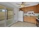 Bright kitchen with wood cabinets, white appliances, and access to a patio at 4642 Via San Rafael, Las Vegas, NV 89103