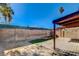 Spacious backyard featuring a covered patio, block wall, and some synthetic turf at 4721 Via Renaldo, Las Vegas, NV 89103