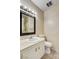 Bathroom featuring vanity with sink, toilet, framed mirror, and shower with curtain at 4721 Via Renaldo, Las Vegas, NV 89103